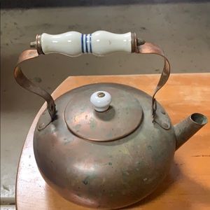 Vintage copper tea pot with porcelain handle